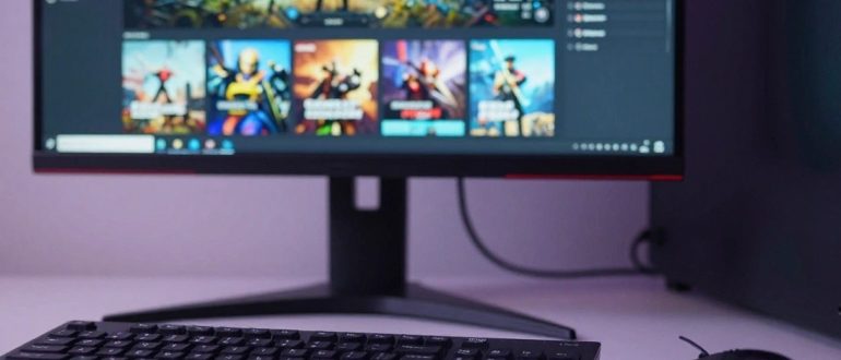 Игровой компьютер с открытой библиотекой игр на мониторе